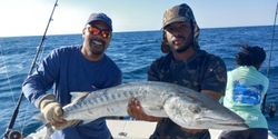 Two people fishing in the water at Key Largo