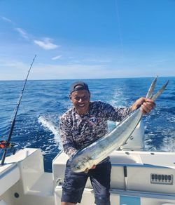 A person fishing in the clear waters of Key Largo