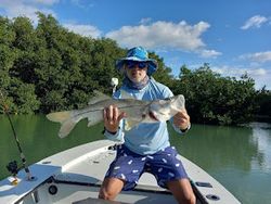 A solo angler fly fishing in the waters of Florida