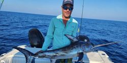 Angler with big fish in tropical Key Largo location