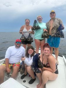 A group of 7 people enjoying a fishing trip in FL