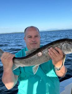 Hooking trophy trout in Lake Champlain