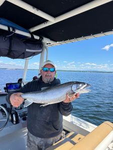 Angler with a bull trout in Cumberland Head