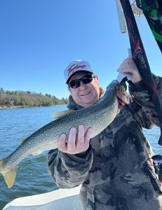 One fisherman reeling in a 27-inch catch in NY