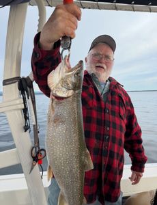 Angler with a lake trout at Cumberland Head