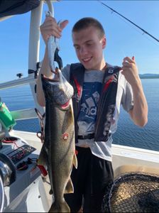 Angler holding a large lake trout in Peru