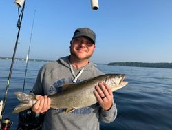 A lone angler fishing for a lake trout in NY