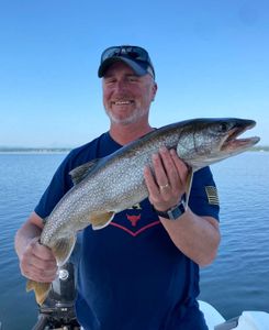 Angler holding a large rainbow trout in NY