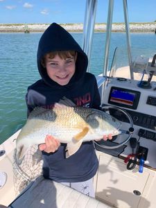A lone fisherman with his catch in Cape Canaveral