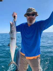 Lone angler in Cape Canaveral with fishing rod