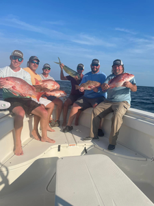 Three fishing enthusiasts enjoying their catch at Fort Myers