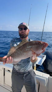 A large red grouper fish caught during a fishing trip in Florida.