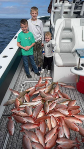 3 anglers fishing in FL with a 19-inch fish