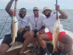 Two huge redfish caught while fishing in Niceville