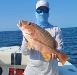 Single fisherman catching a fish in Key Largo