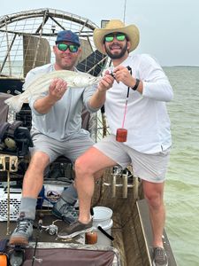 Two people fishing in Port Mansfield