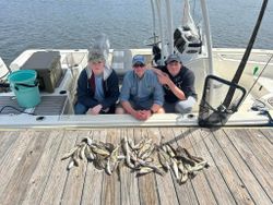 Three people fishing in TX