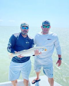 Two people fishing together in Port Mansfield