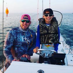 Two people enjoying fishing and hunting in TX
