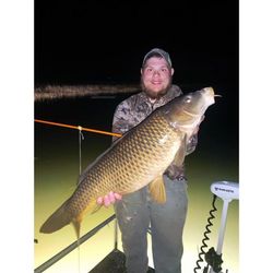 Single fisherman enjoying a great catch in Burlington