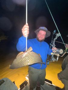 A lone fisherman casting their line in the waters of Burlington