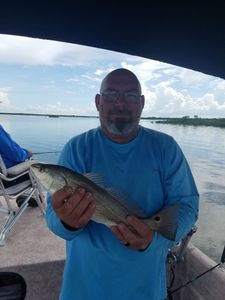 Angler holding a redfish in Florida