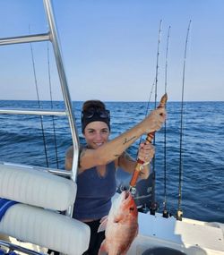 Angler holding a fish at Fort Walton Beach