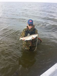 Angler fishing with rod and reel in Galveston