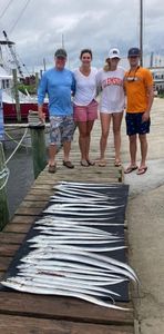 Group of four people enjoying a fishing trip in NC