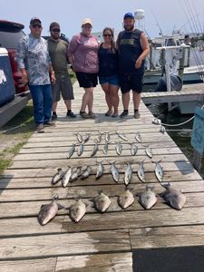 Group of 5 people fishing in Wanchese