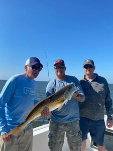 A group of 3 people fishing in North Carolina