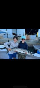 Two anglers fishing at Port Canaveral, Florida