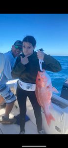 Two people fishing on a sunny day in Florida