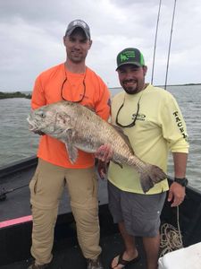 2 people fishing with big 27-inch fish in Port O'Connor