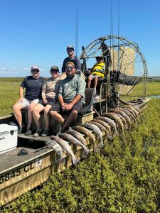 Group of 5 people fishing at Port O'Connor