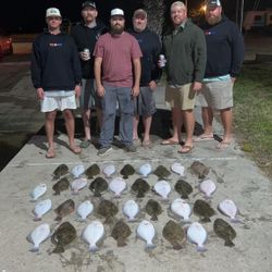 Six people smiling and posing for a photo in Port O'Connor