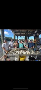 6 people enjoying a fishing trip in Hopedale