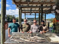 A group of 4 people enjoying a fishing trip in LA