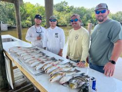 Four people fishing in Hopedale