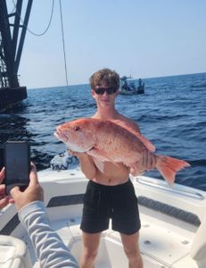 Angler with rod and reel fishing in LA