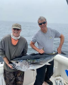 A group of 2 people fishing in MA