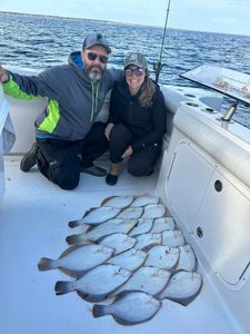 Two people enjoying a fishing tour in Orleans