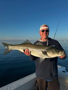 Image of a 32-inch striped bass caught while fishing in Orleans