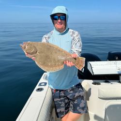 Angler with a summer flounder catch in Massachusetts
