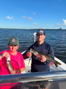 Two snook fish caught by two people while fishing in FL