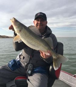 An angler with a 22-inch fish in ND