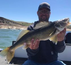 A lone fisherman reeling in a 28-inch catch at ND