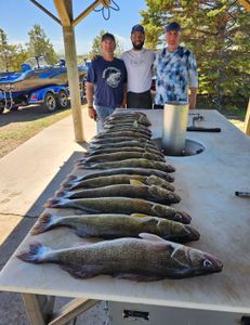 A group of 3 people fishing in ND