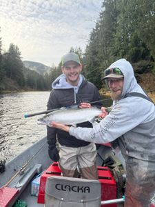 Angler holding a rainbow trout in Tillamook