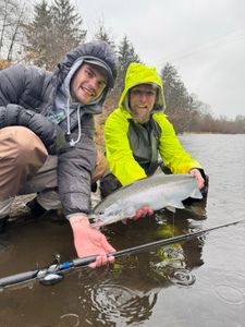 Angler holding a rainbow trout in Oregon